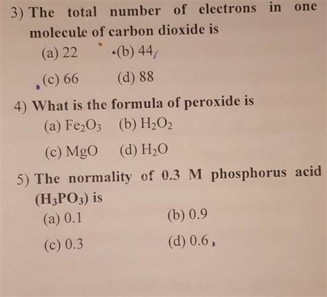 The total number of electrons in one molecule of carbon dioxide is .